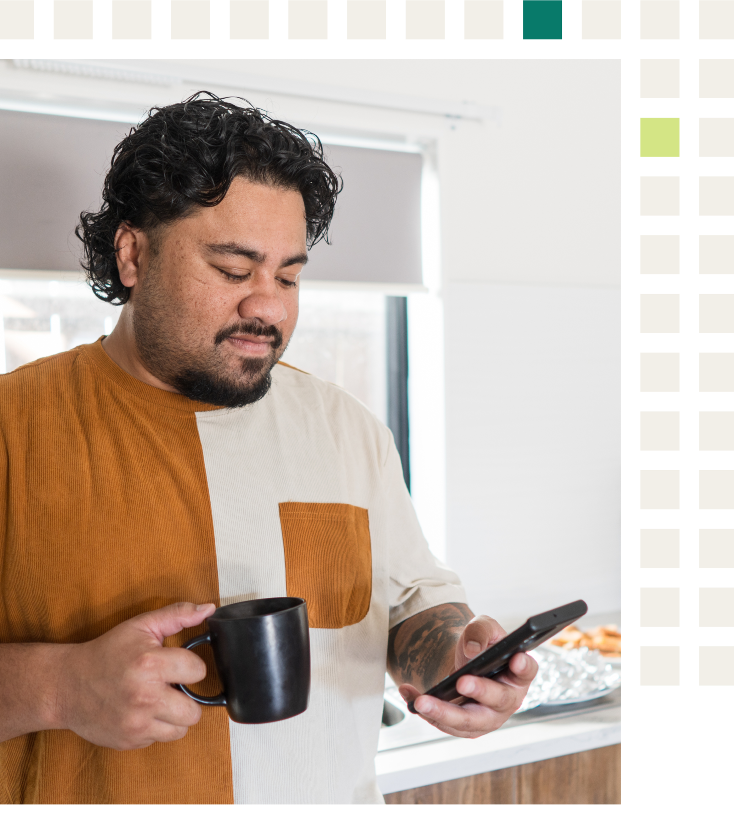 A Samoan man in his forties with prediabetes and hypertension looking at his virtual chronic care program app for healthy breakfast choices while having coffee in his kitchen.